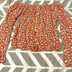 Coral orange overshoulder floral print crop top with wodden buttons on the front